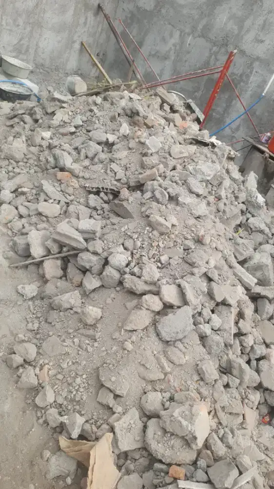 Kirim urug buang puing bangunan rumah