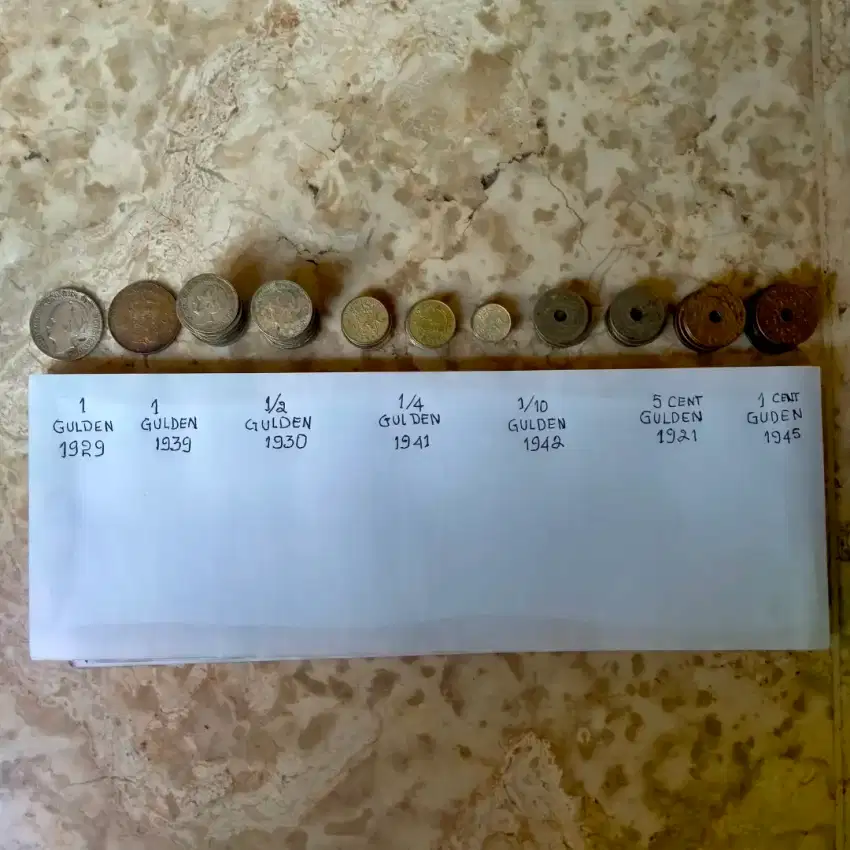 Dijual uang koin kuno rupiah,gulden,dolar.