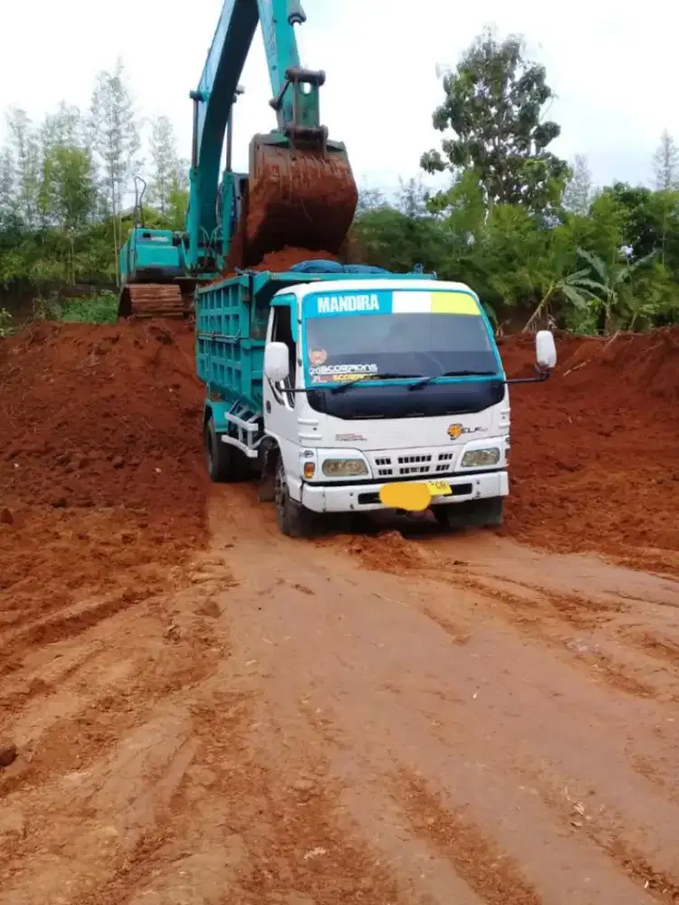 Tanah merah campur pengurugan urug buang puing sampah urugan bongkaran