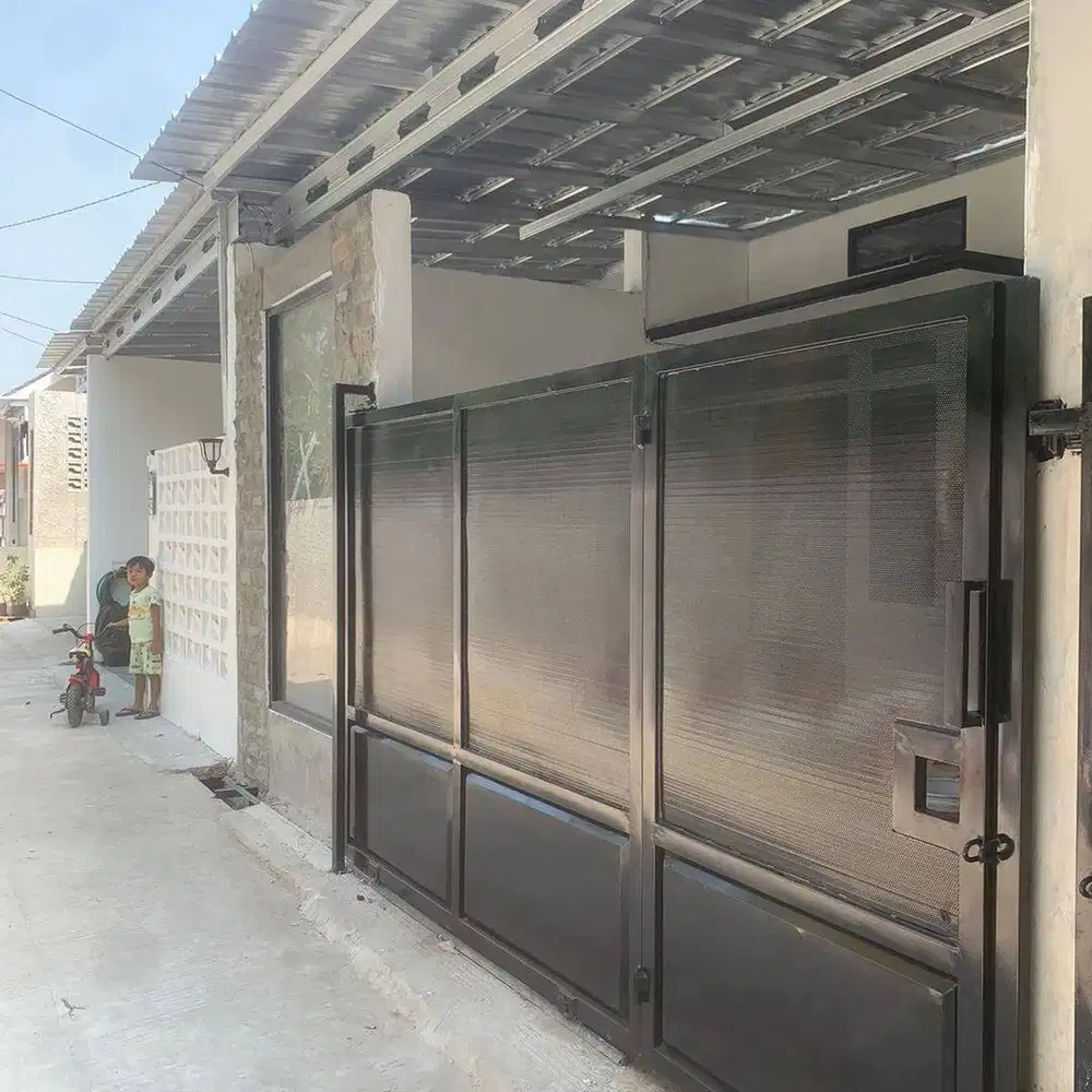 pagar rumah plat lubang