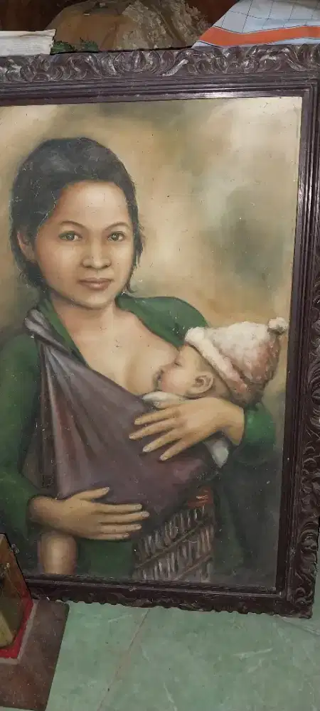 Lukisan ibu menyusui bayi