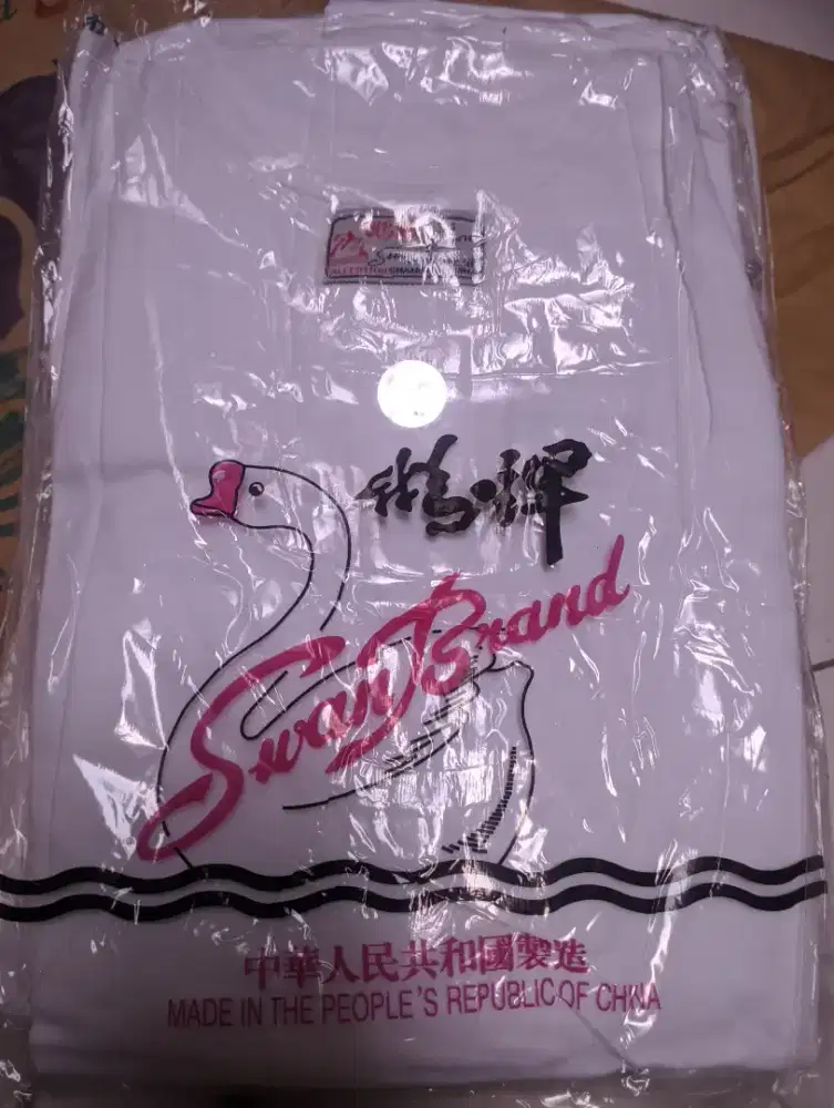 Kaos Singlet/Oblong Merk SWAN Asli.