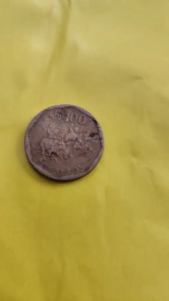Koin Lama 100 rupiah kuning