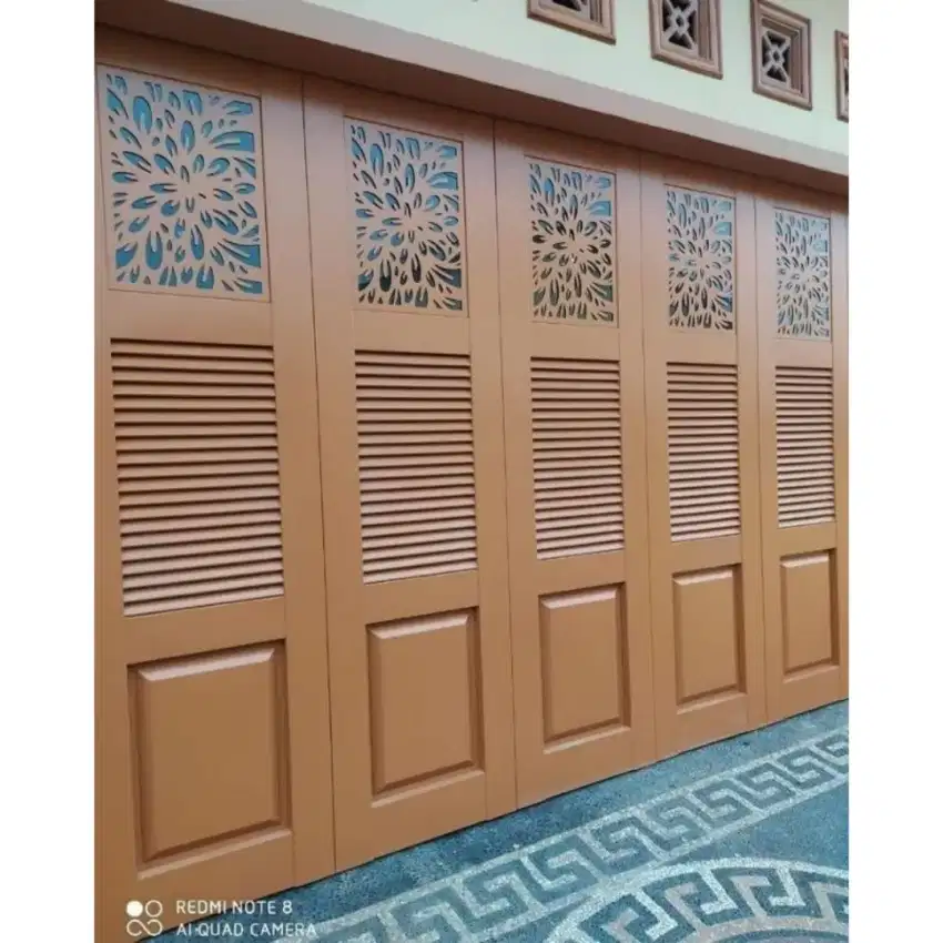 Pintu gerasi dan ruko model lipat pelat cutting laser bergeransi