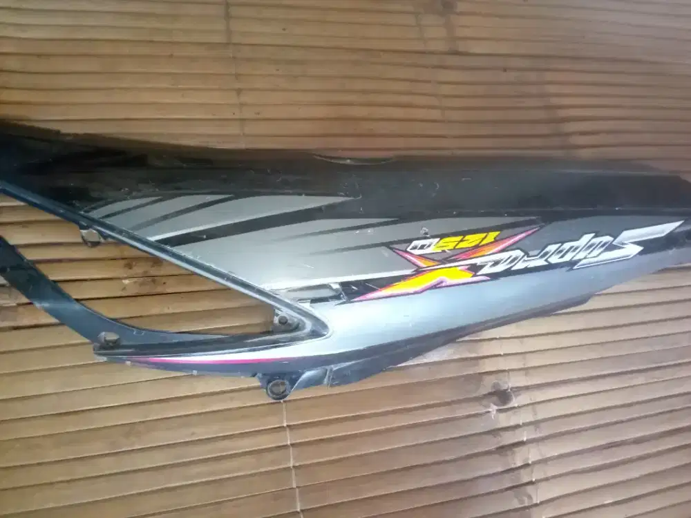 cover samping kiri supra x 125