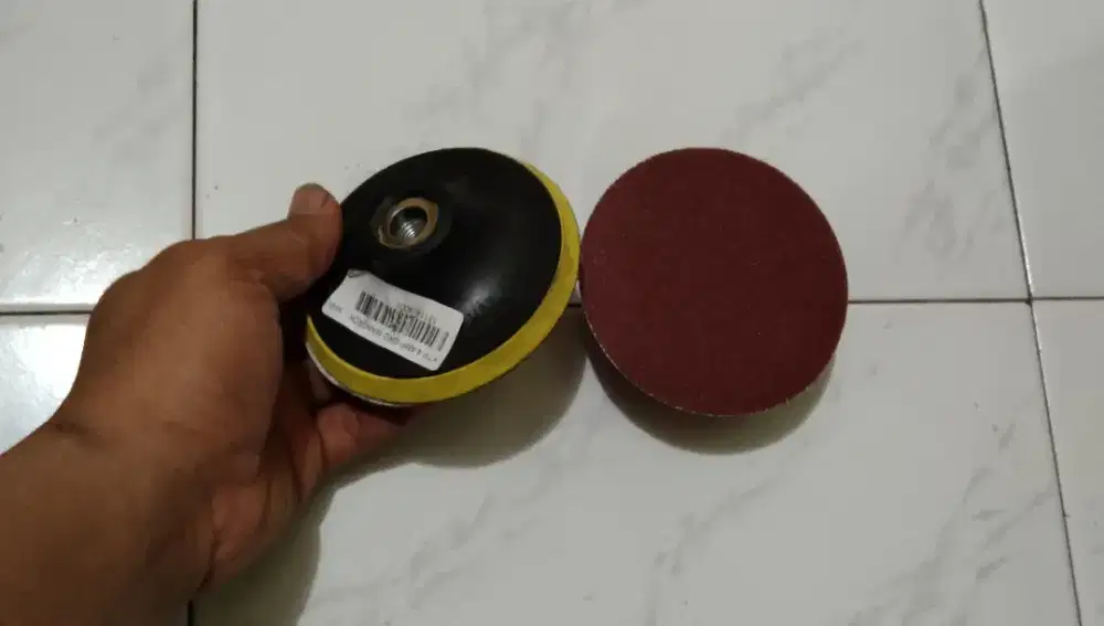 Pad amplas mesin gerinda