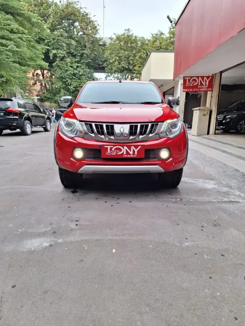 Strada Triton Exceed DC 4x4 AT 2017 Merah