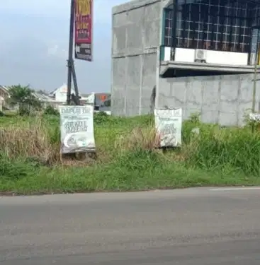 Tanah pinggir jalan raya menganti