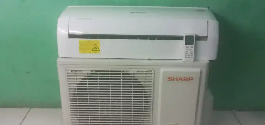 ac sharp 1/2 pk bergaransi