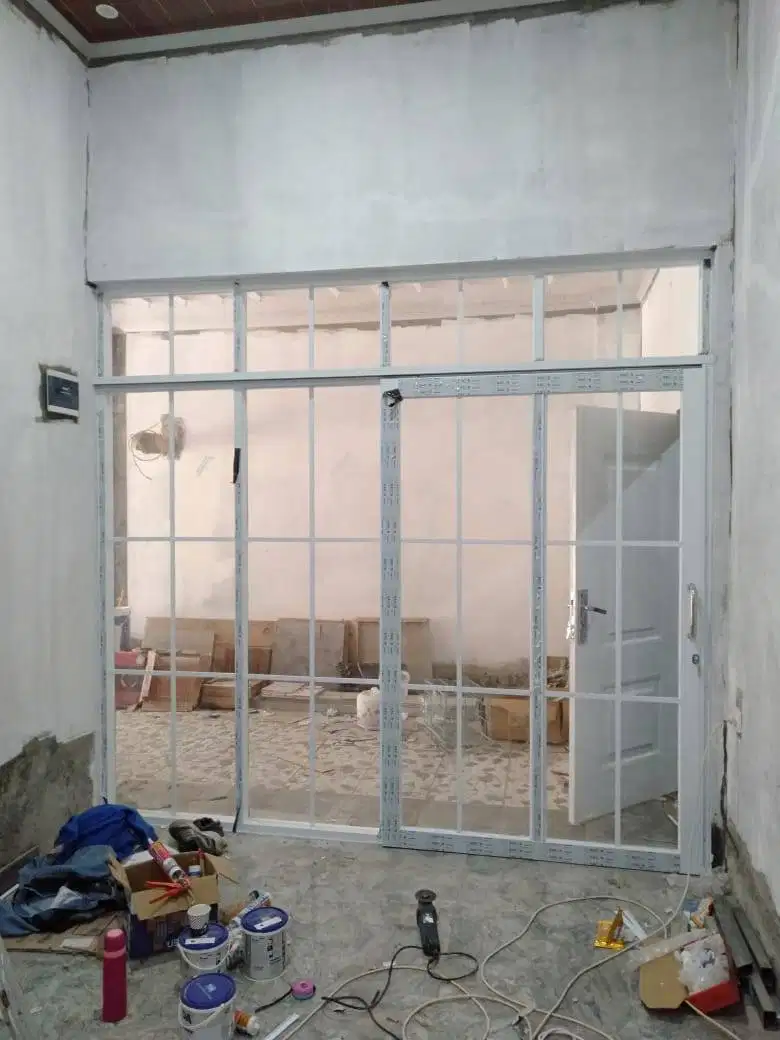 Pasang Partisi 2 Muka Gypsum + Kusen Jendele Pintu Alumnium +Kaca +Cat