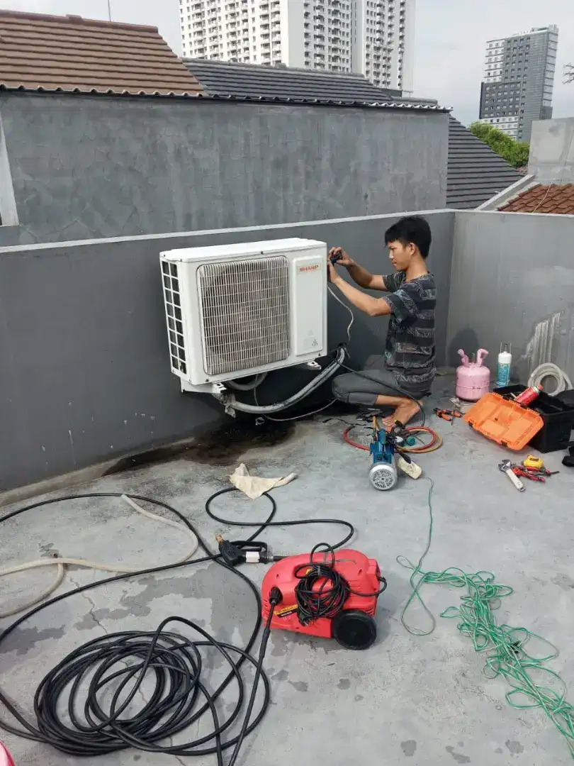 SERVICE AC BONGKAR PASANG AC