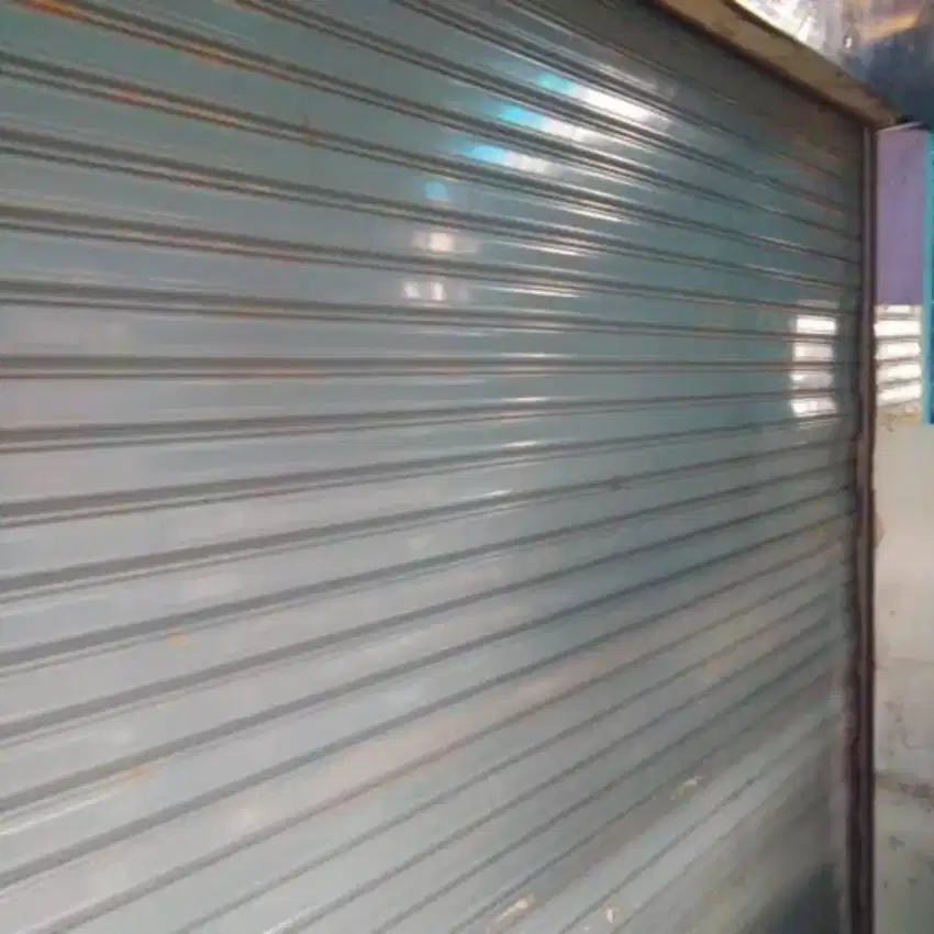 Tukang folding gate rolling door