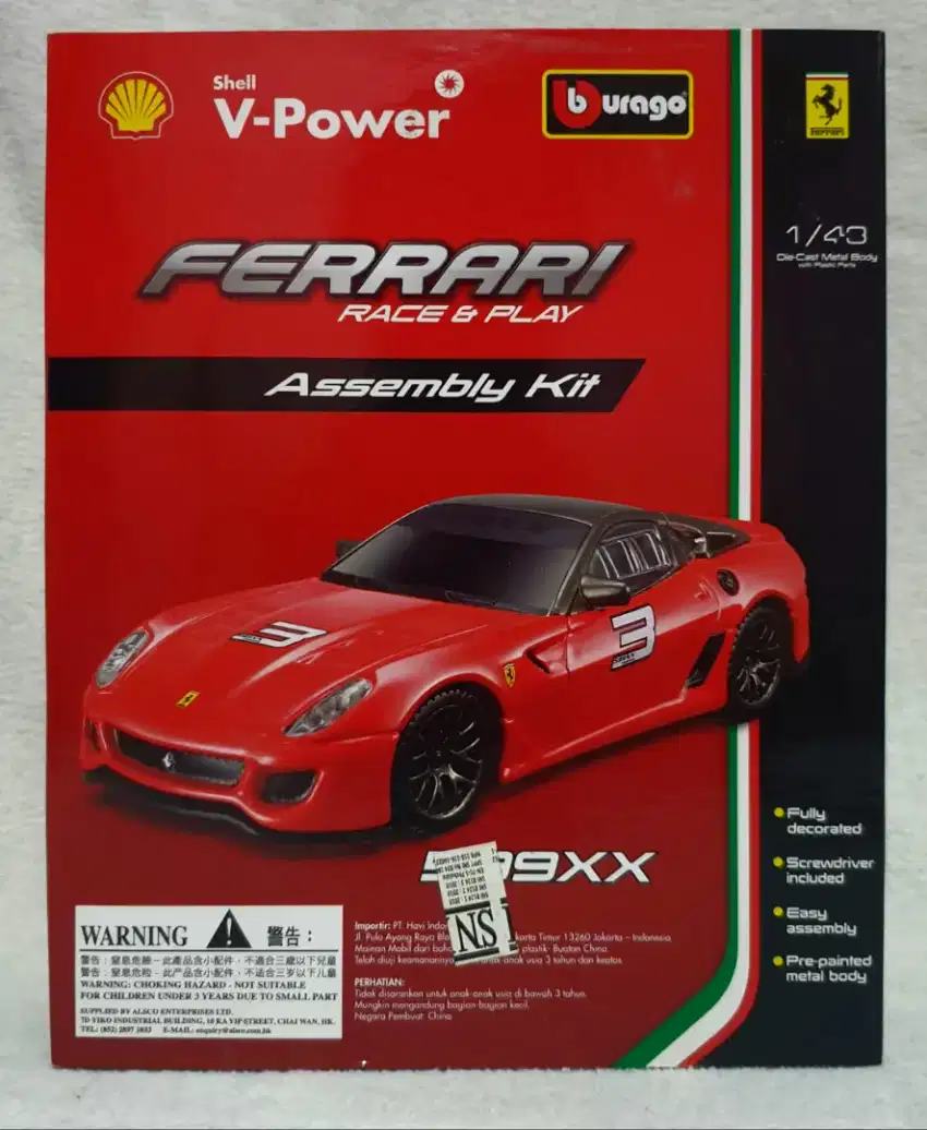 Bonus: Diecast RC. Diecast Burago Shell Ferrari 599xx 1:43, New in Box