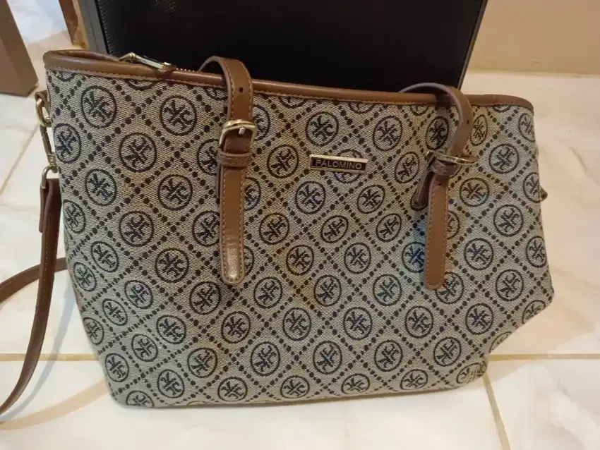 Tas branded like new