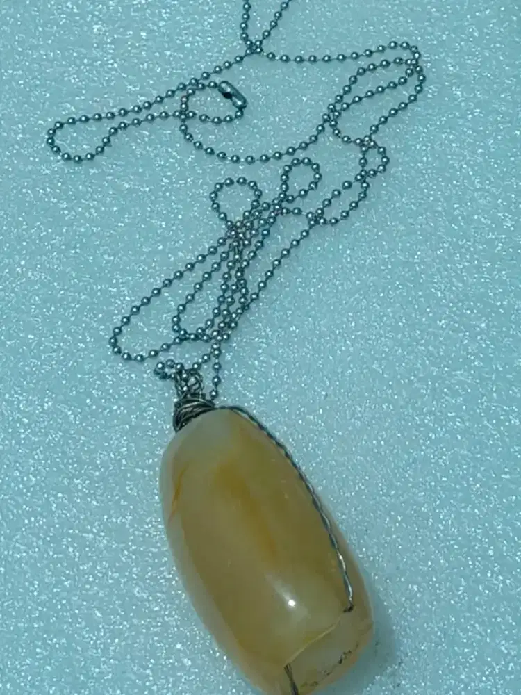 Kalung perak batu combong .