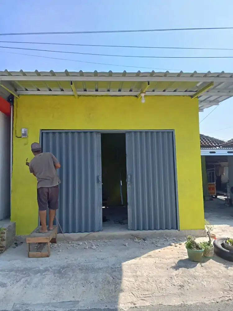 Folding gate rolling door