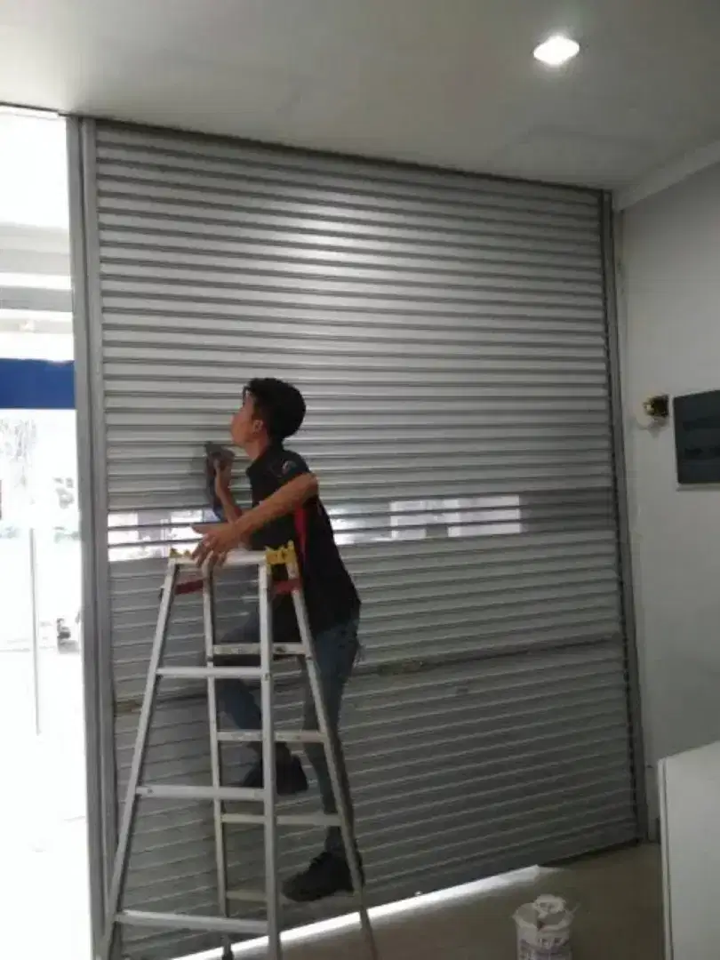 Tukang reparasi pintu rolling door folding gate murah