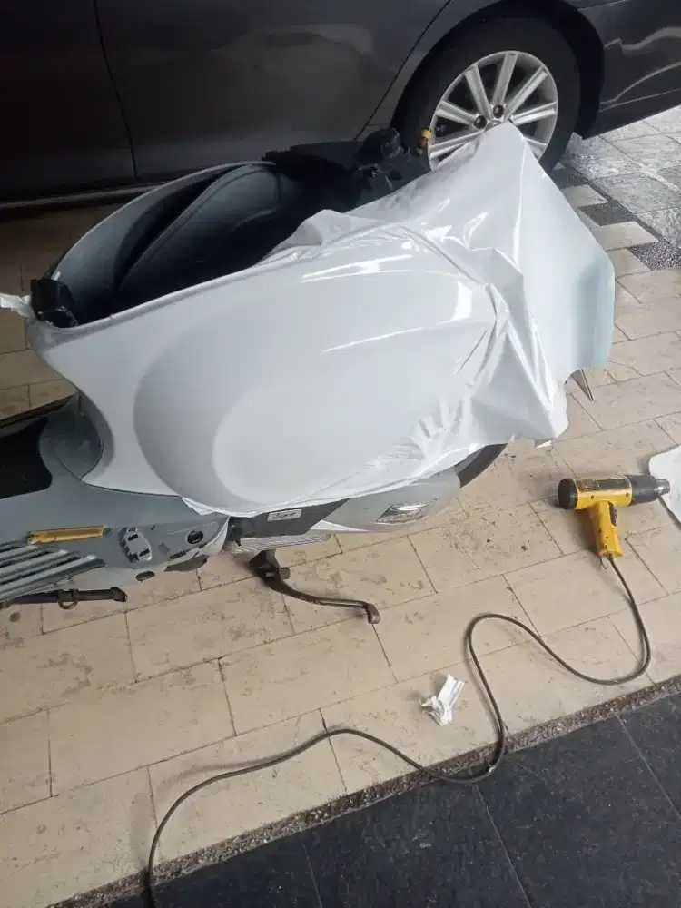 Kaca film sanblaz dan wrapping