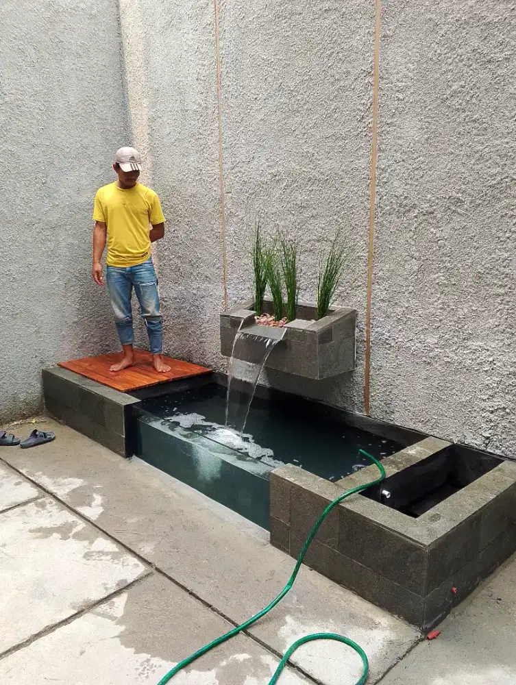 Kolam ikan koi minimalis kaca dan taman