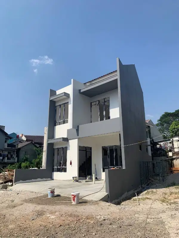 Rumah minimalis moderen dua lantai di Kelapa dua wetan.