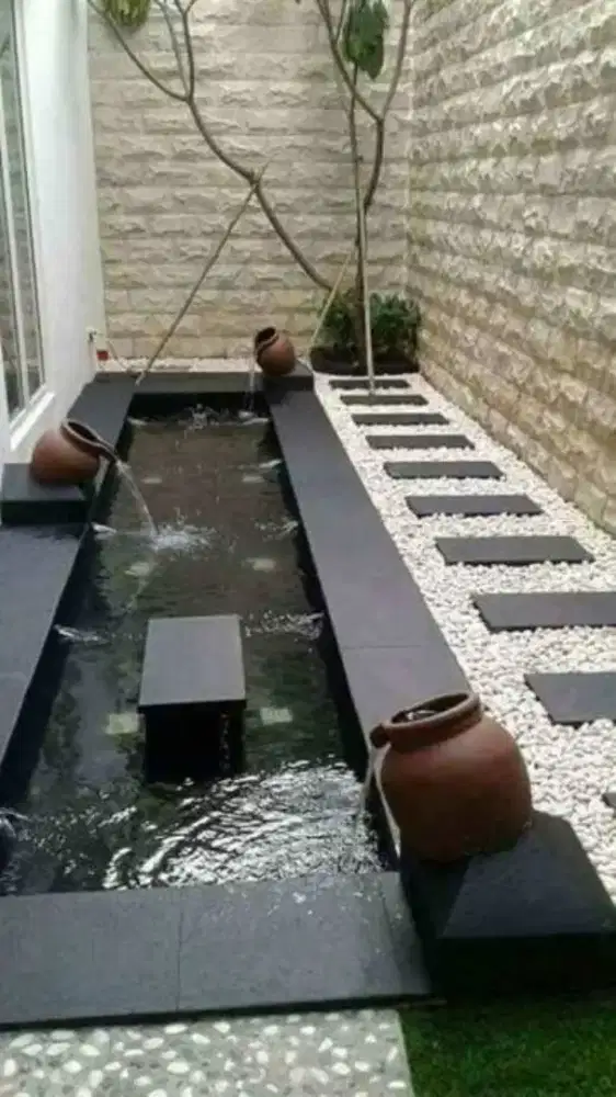 Jasa pembuatan kolam ikan koi minimalis dan taman batu alam