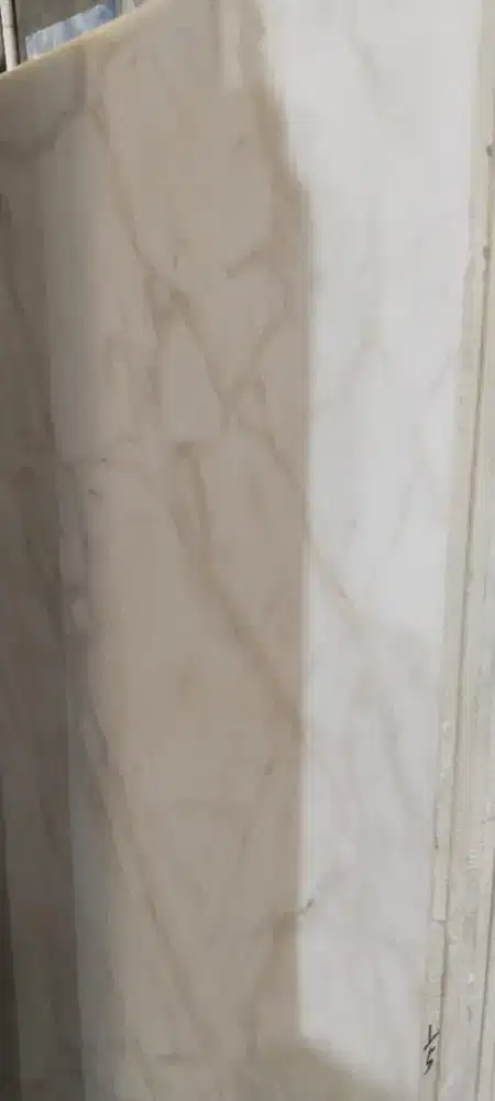 Proses pemasangan granit Quadra