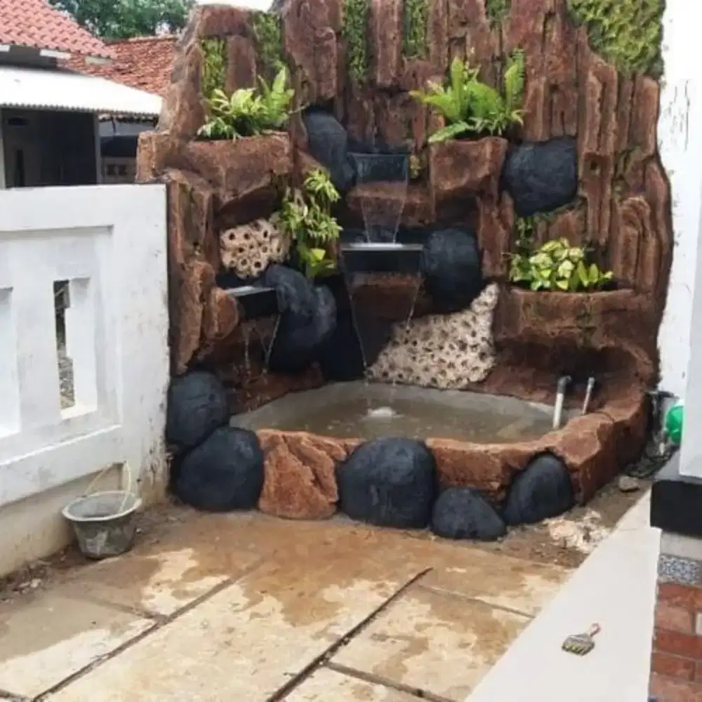 Pembuatan kolam ikan relif tebing