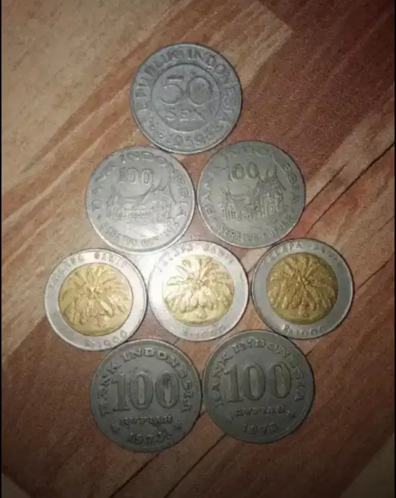 Uang koin logam kuno kelapa sawit rumah gadang garuda