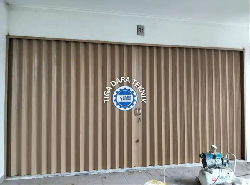 menjual Pintu Ruko Folding Gate, Pintu Geser Besi Tiga Dara Teknik
