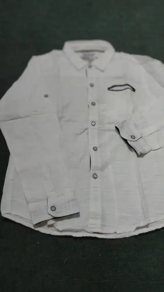 Kemeja anak merk Osella.