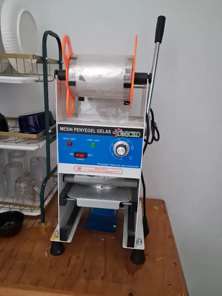 Mesin penyegel gelas OMICKO