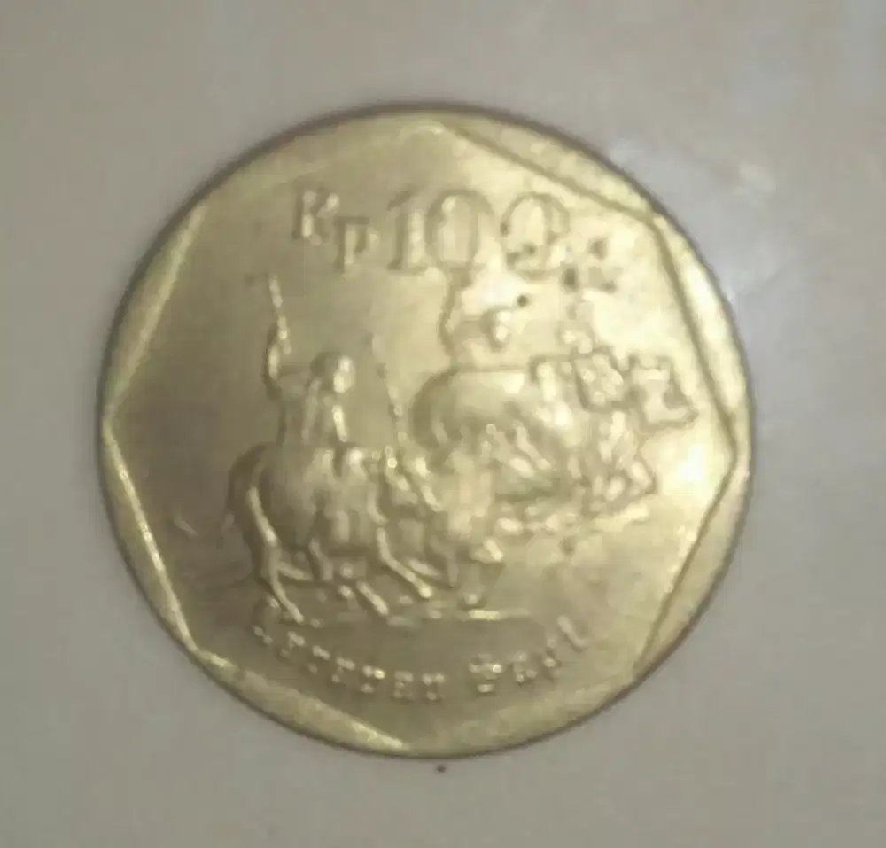 Uang koin Rp 100 karapan sapi