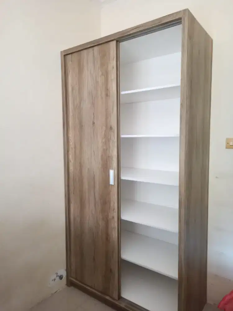 Lemari dua pintu sleding full isi rak ambalan