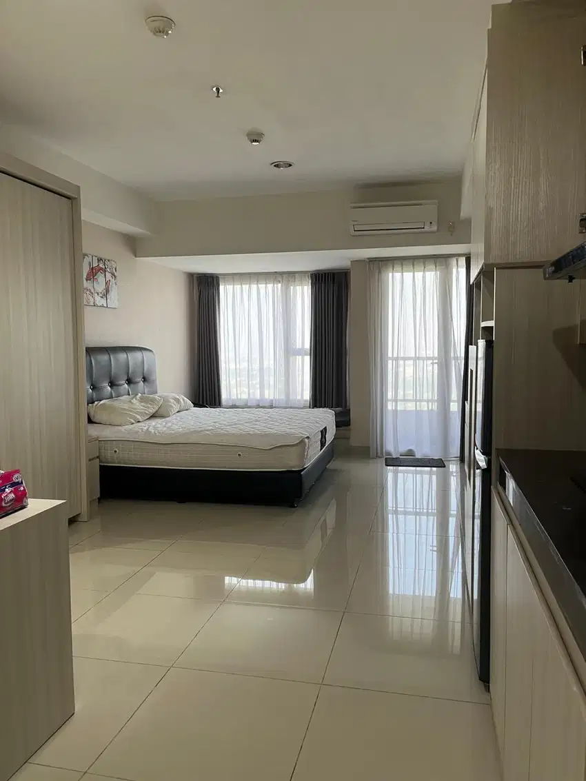 Sewa Apartemen Studio 42 m², Orange County Lippo Cikarang, 65 Jt/Thn!