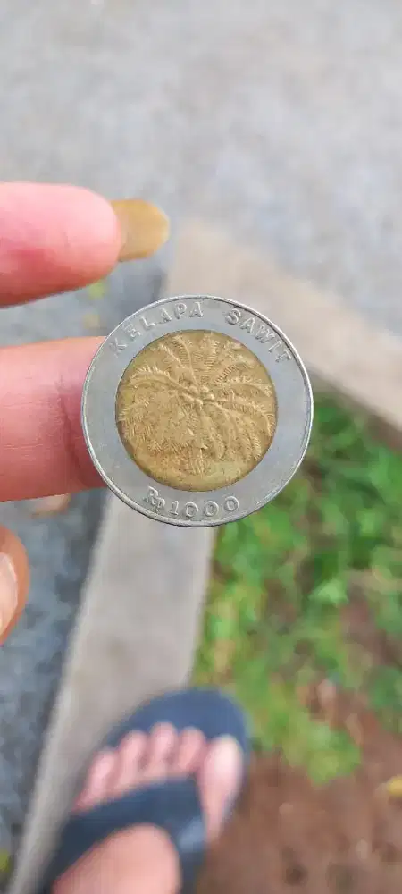 Uang coin 1000 an