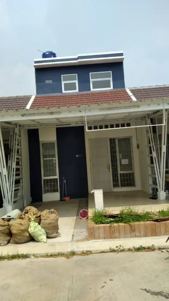 over kredit rumah Mutiara Gading City beserta isinya