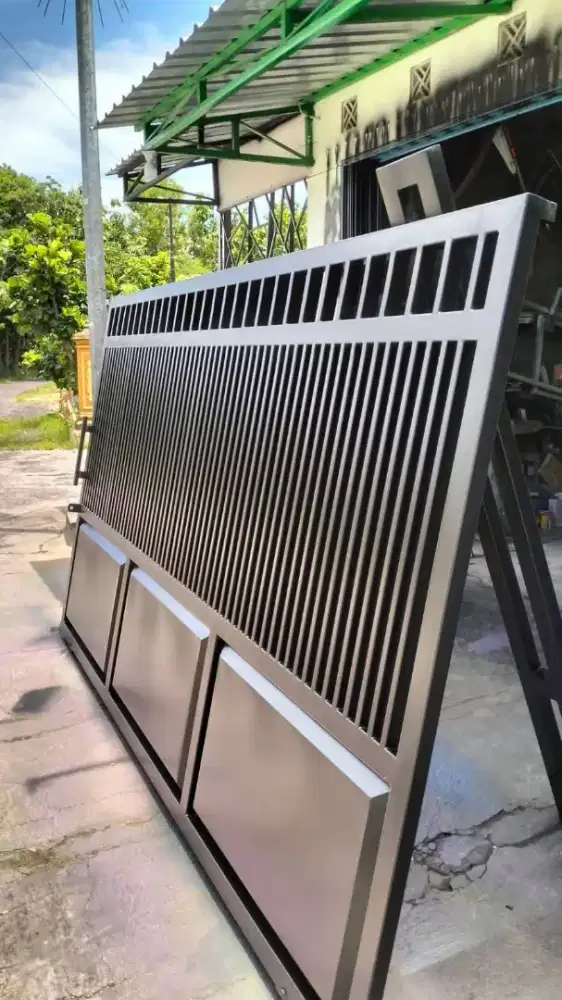 PINTU GERBANG PINTU LIPAT PINTU DORONG PINTU GARASI PINTU PLAT PINTU