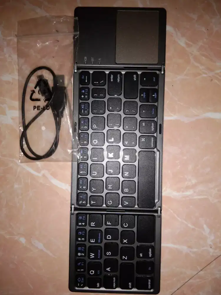 Keyboard Bluetooth Lipat