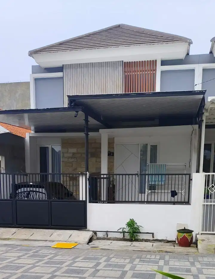 Rumah minimalis modern 1 lt New Gres di Griya Kebraon Surabaya murah