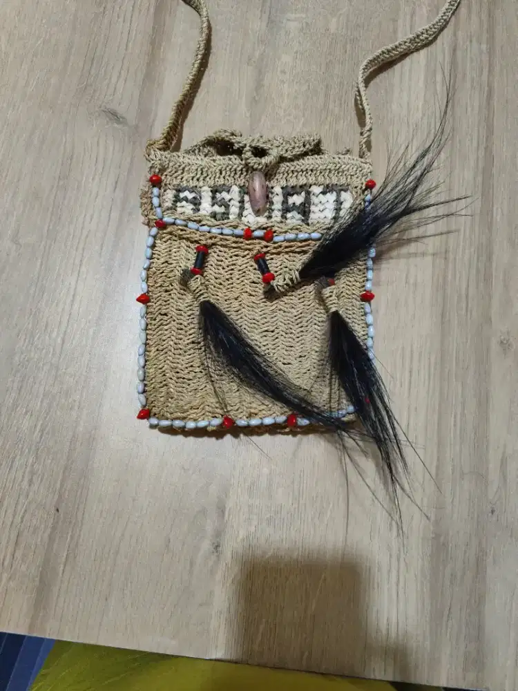 Tas noken asli buatan asmat papua baru pale manik