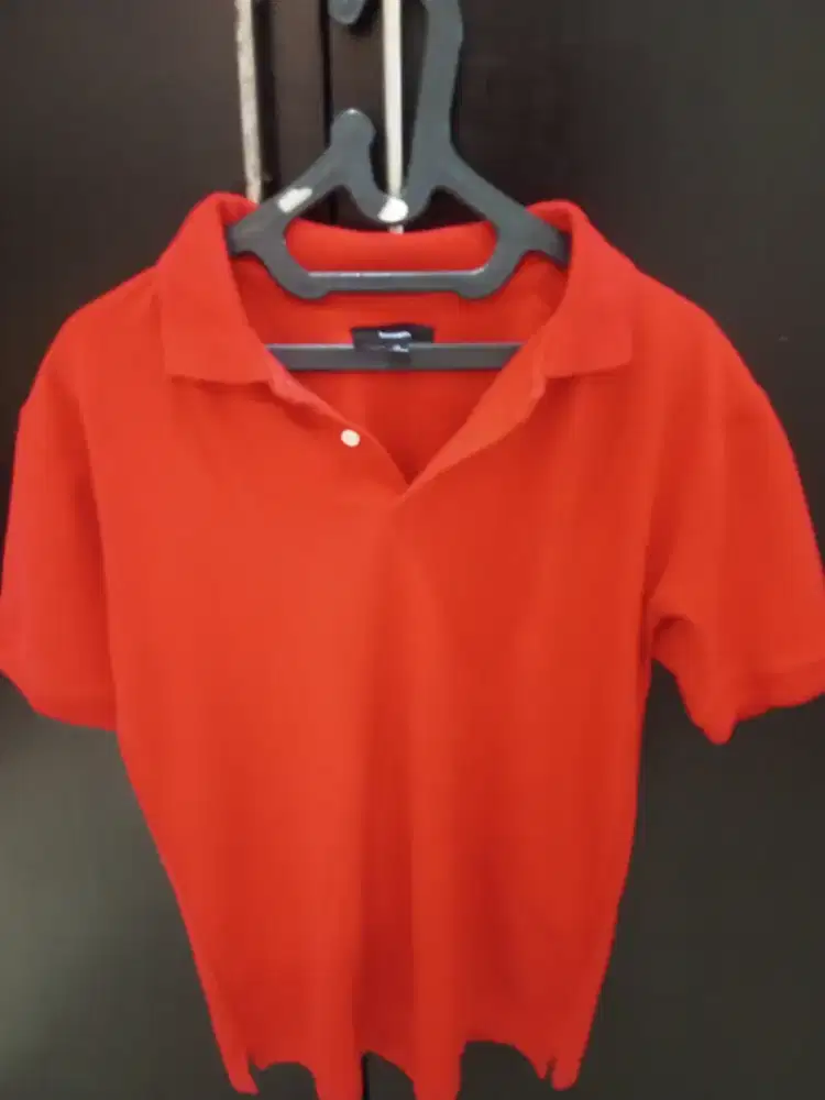 Polo merah bossini size L