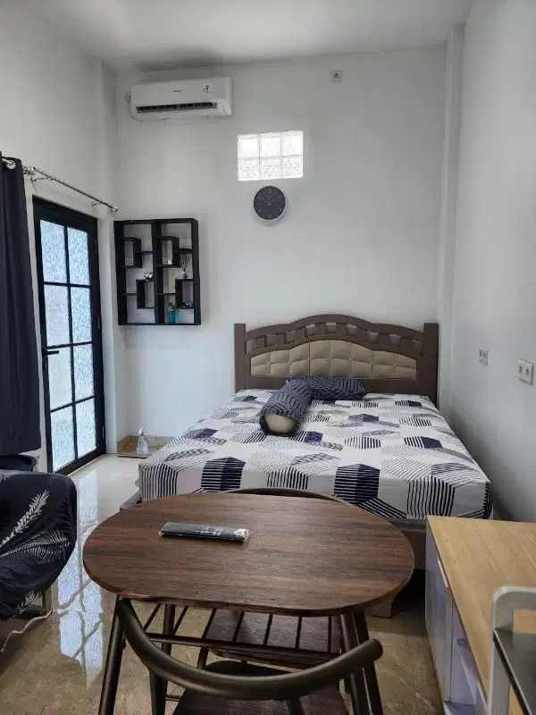 Kos konsep apartemen
