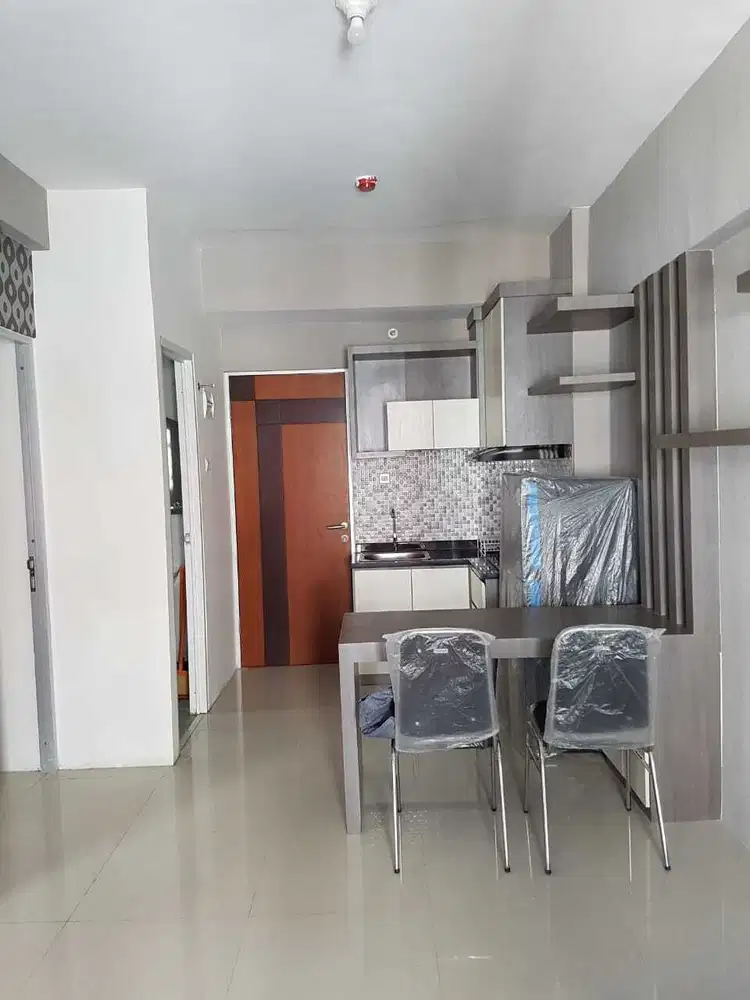 Apartement dengan 2 kamar tidur dan sky garden