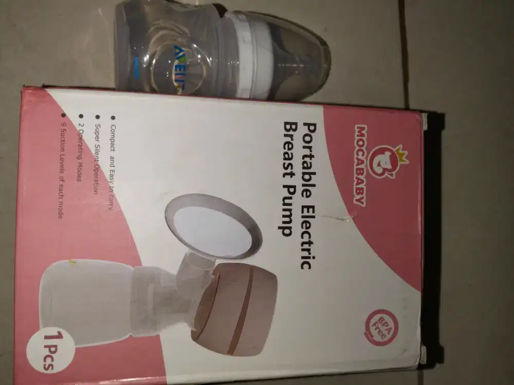 Portable electric breast pump