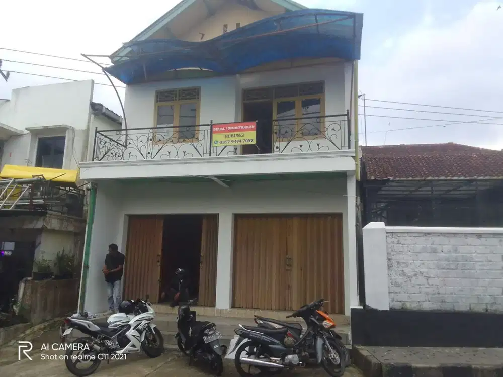 Dijual lahan dan bangunan rumah 2 lantai pinggir jalan raya