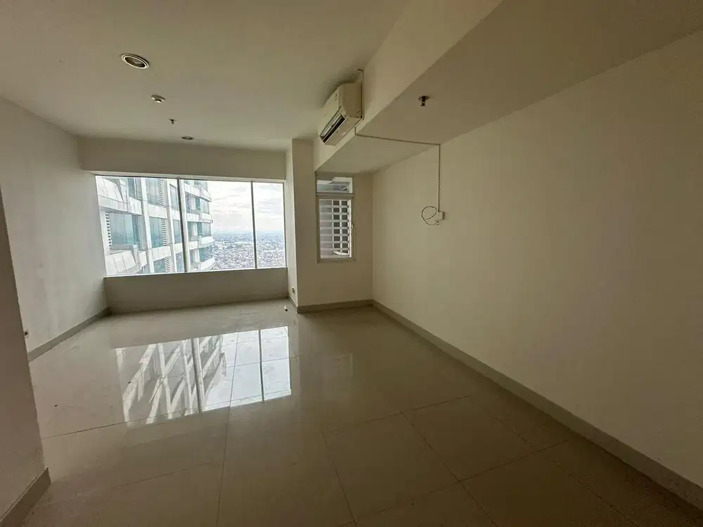 Dijual  Cepat  Apartemen 1 BR  Unfurnish dengan akses Mall dibawahnya