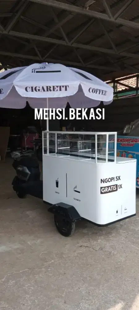 Gerobak sepeda listrik kopi dingin dan rokok