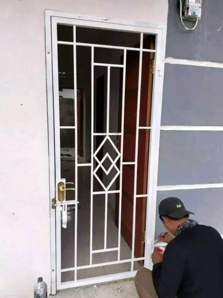 Tukang las pasang pintu teralis minimalis murah