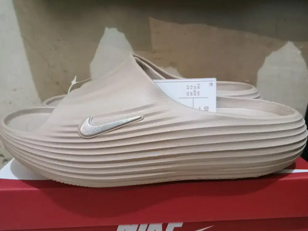 Nike ReactX Rejuven8 slide in a sail colorway