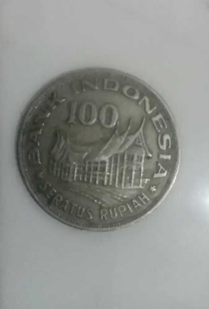 uang koin motif ruma gadang